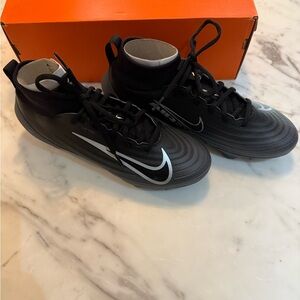 Nike Men Black Cleats with White Swoosh